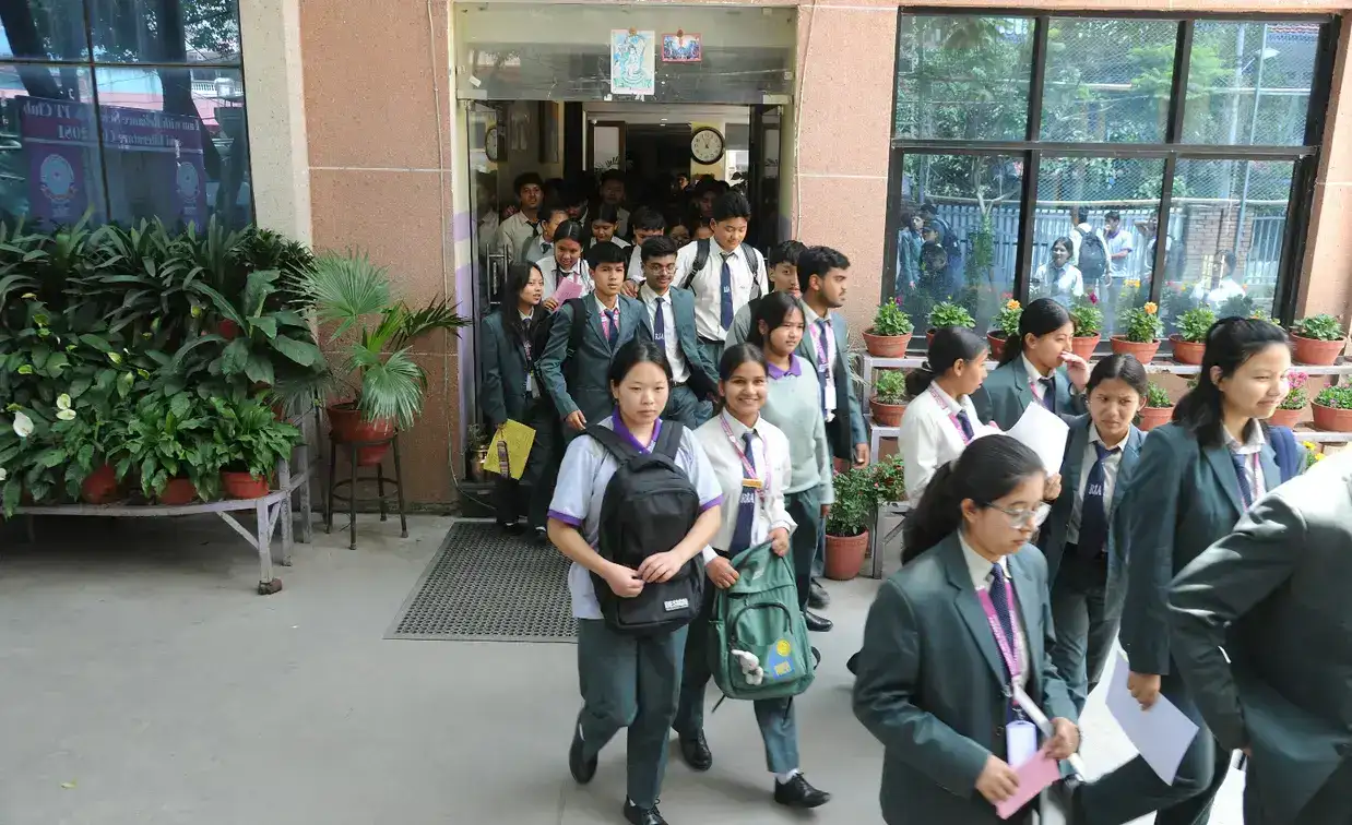 students walking out of college