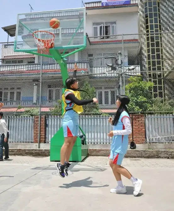 students playing basketball in college